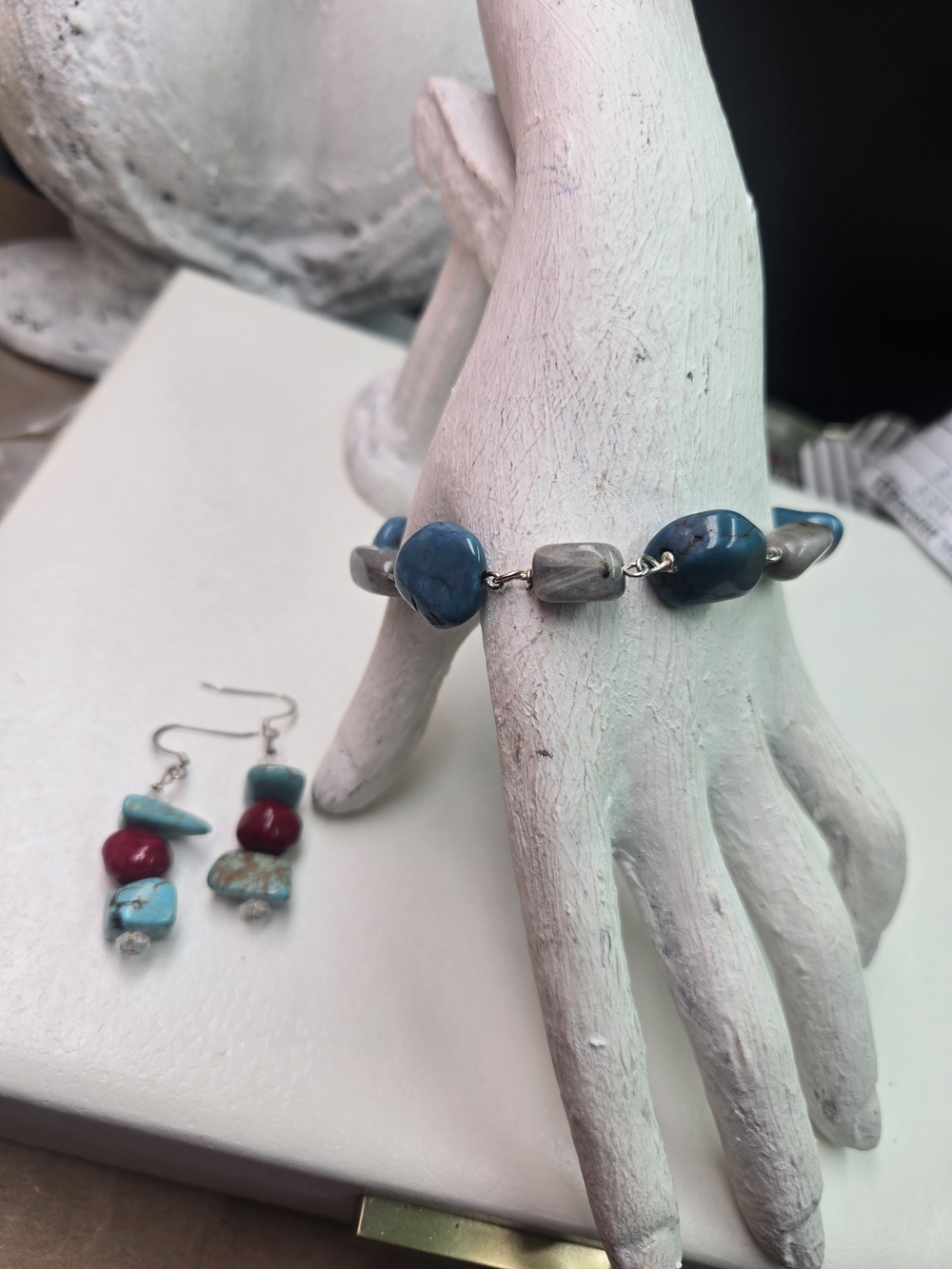earrings and a matching bracelet set featuring turquoise, red, and blue gemstone